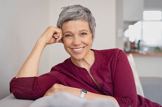 Woman Smiling After Teeth Whitening Treatments In Gainesville, FL