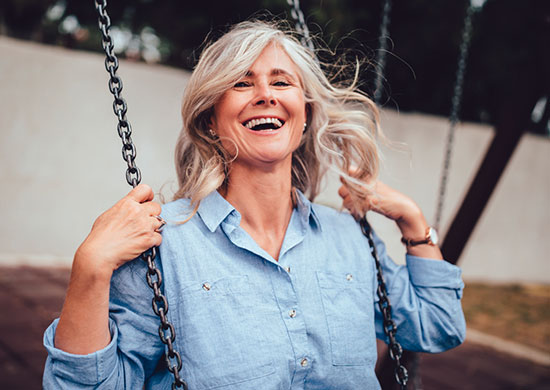 Image Of A Woman On A Swing