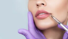 Woman receiving lip injections