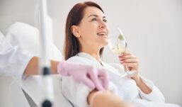 Woman receiving IV therapy