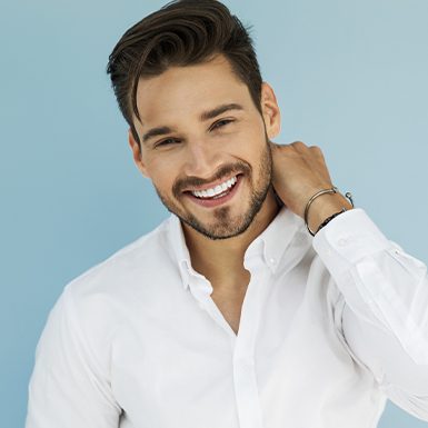 Man touching neck