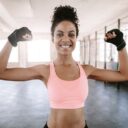 Woman flexing her arms at the gyn