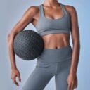 Woman holding medicine ball