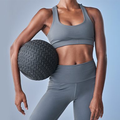 Woman holding medicine ball
