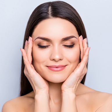 Beauty model touching temples